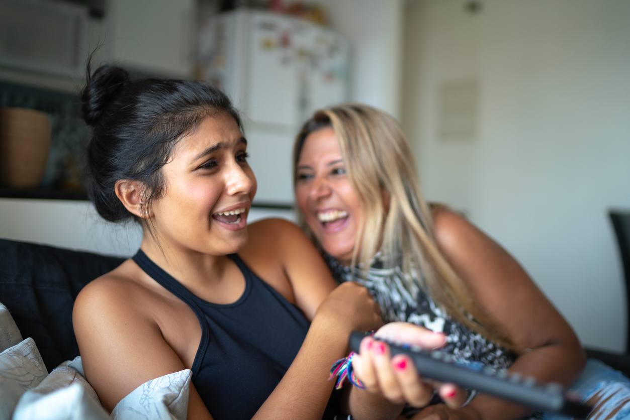 Mother and daughter laughing together.