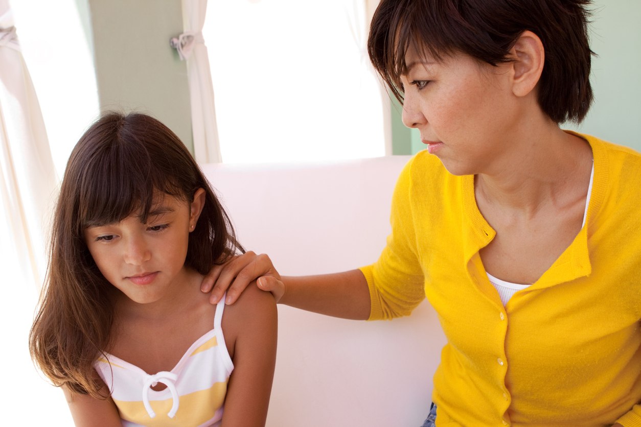 Mother listening intently to sad daughter.