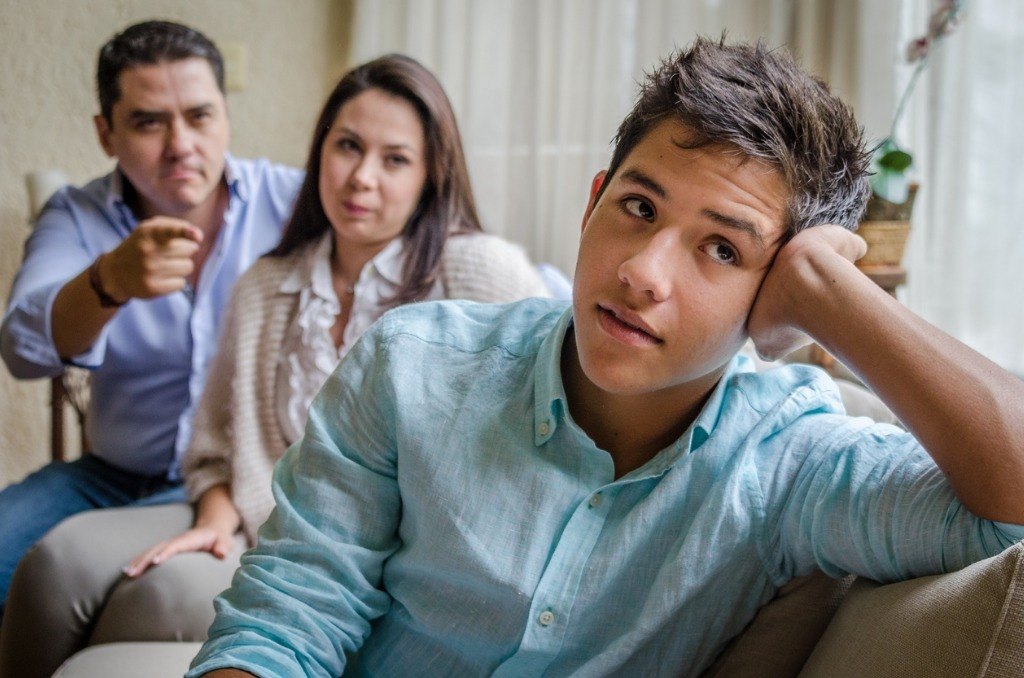 Young teen ignoring parents.