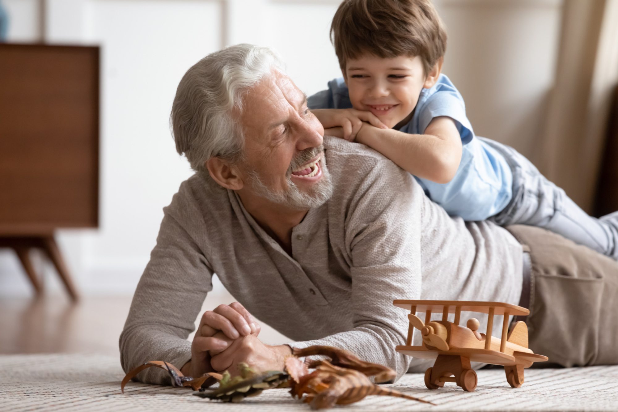 Grandpa and grandson playing together.