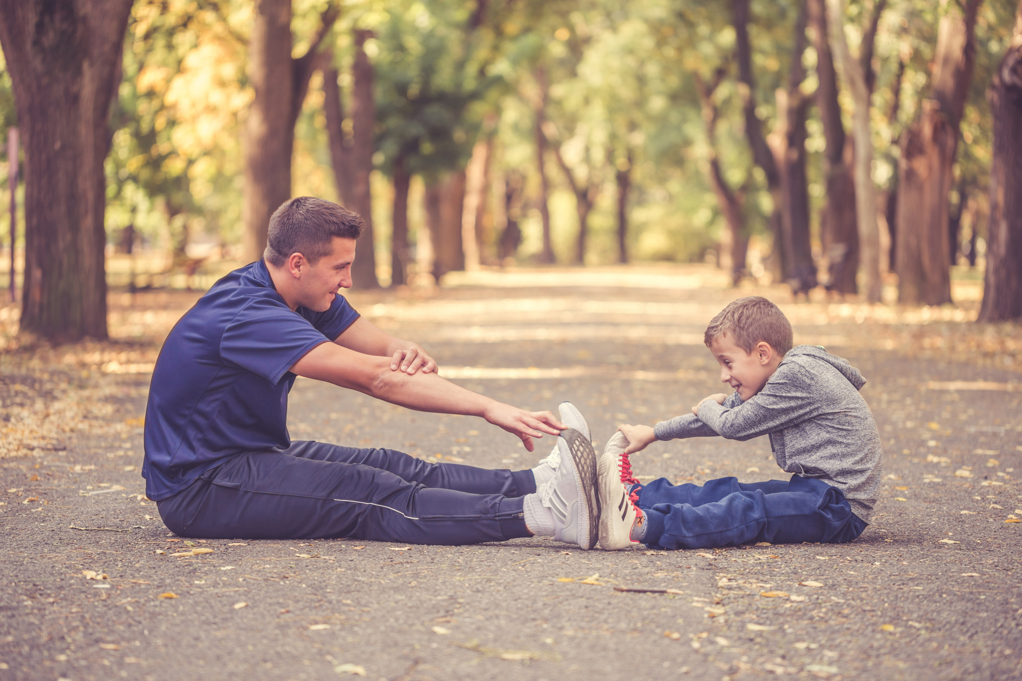 Father and son stretching together.